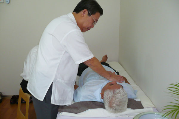 Master Tan treating patient