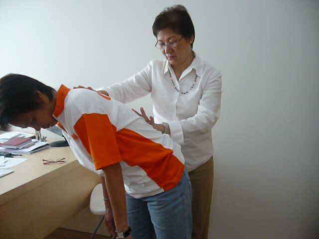 Sifu Connie treating patient with slipped disc